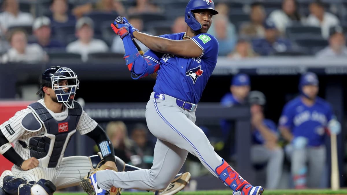 Toronto Blue Jays right fielder Jesus Sanchez (12) follows through on an RBI double against the New York Yankees during the ninth inning at Yankee Stadium.