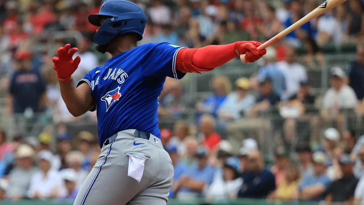 Toronto Blue Jays designated hitter Eloy Jimenez (74) hits an RBI double during the first inning against the Boston Red Sox at JetBlue Park at Fenway South.