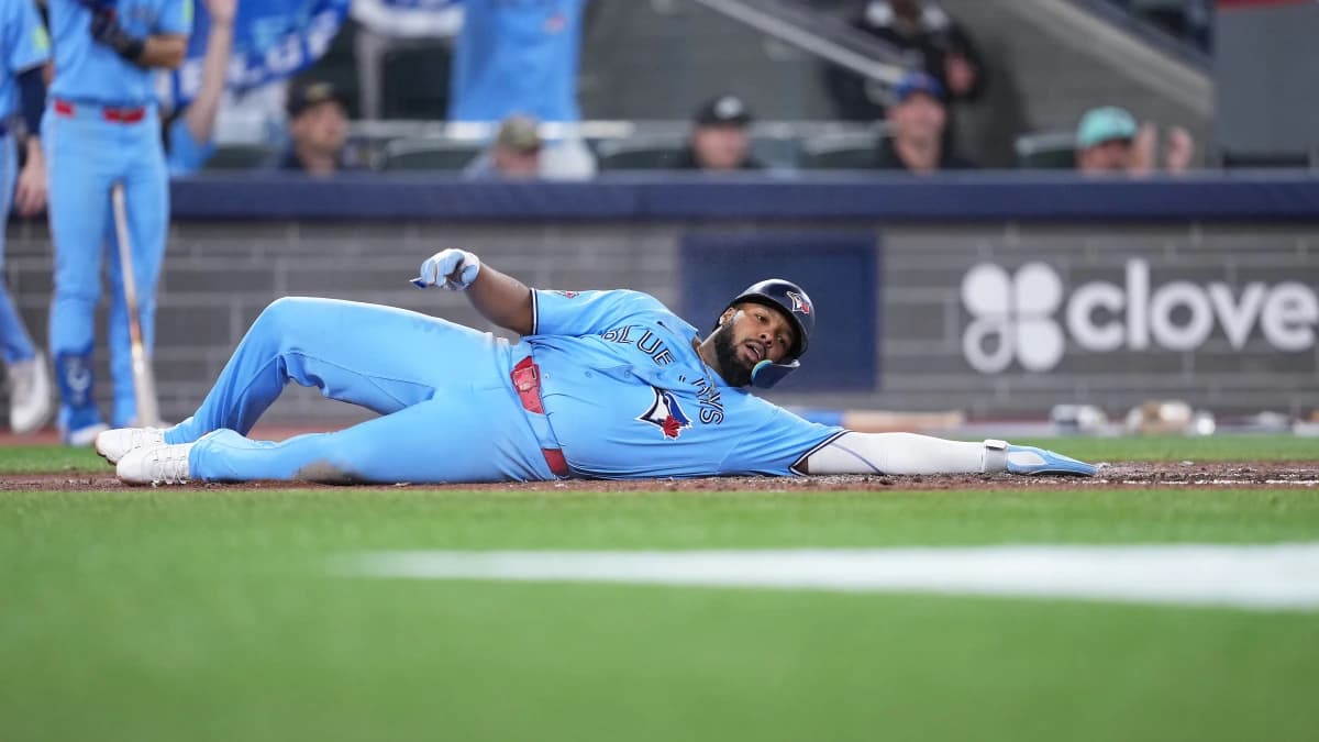 Toronto Blue Jays first baseman Vladimir Guerrero Jr. (27) gets hit with a pitch against the Pittsburgh Pirates during the fifth inning at Rogers Centre.