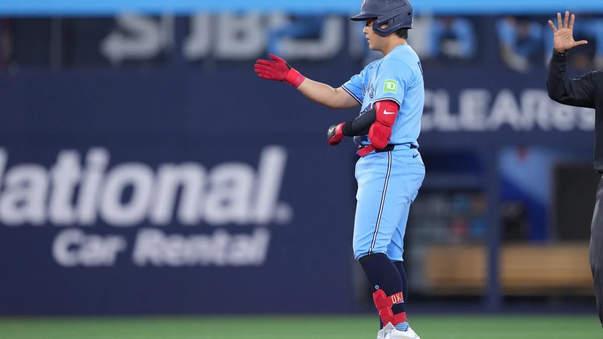 Toronto Blue Jays third baseman Kazuma Okamoto (7) celebrates hitting a double against the Pittsburgh Pirates during the second inning at Rogers Centre.