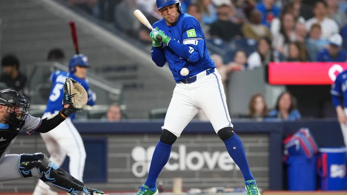 Toronto Blue Jays designated hitter George Springer (4) is hit with a pitch against the Miami Marlins during the fifth inning at the Rogers Centre.
