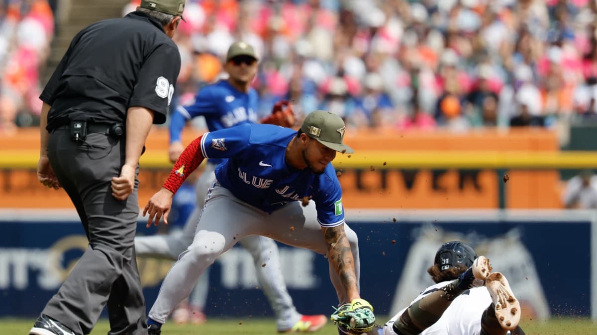 Detroit Tigers second baseman Zach McKinstry (39) is tagged out at third by Toronto Blue Jays second baseman Lenyn Sosa (50) after he tries to steal the base in the seventh inning at Comerica Park.