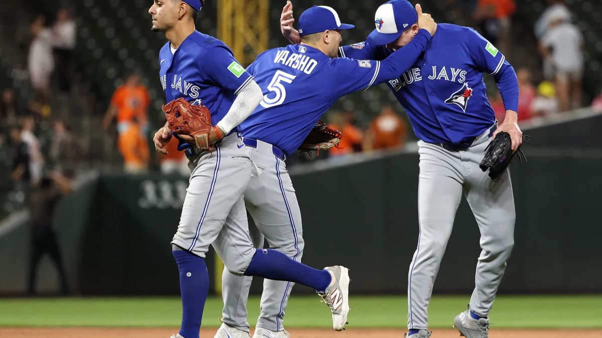 Toronto Blue Jays players celebrate after a game against the Baltimore Orioles at Oriole Park at Camden Yards.