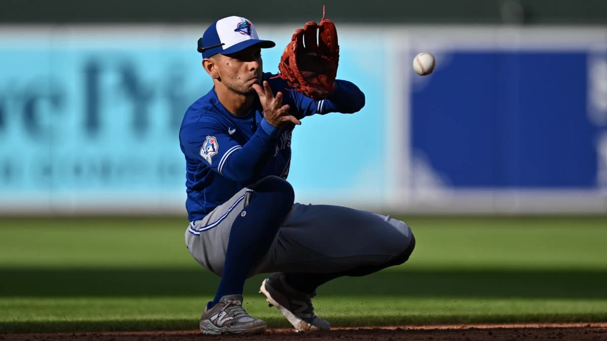 Toronto Blue Jays infielder Andres Gimenez (0) fields a ground ball in the eighth inning against the Baltimore Orioles at Oriole Park at Camden Yards.