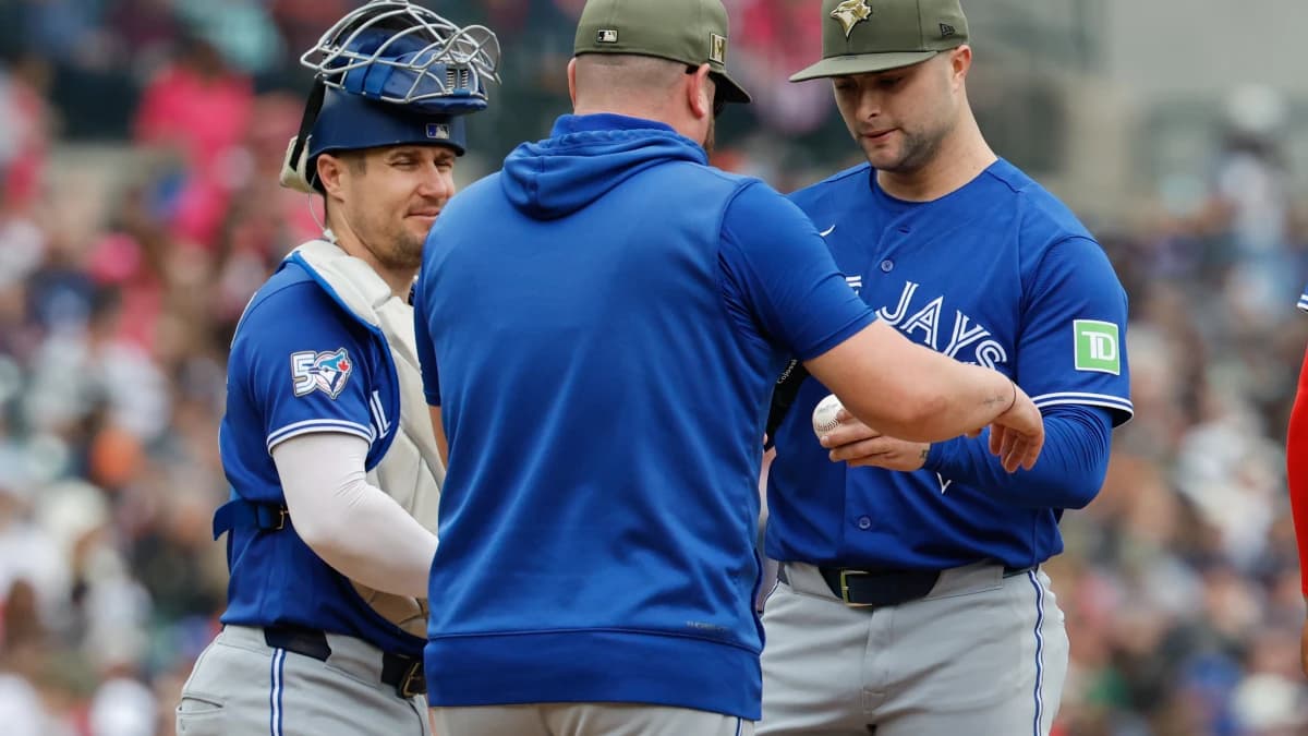 Toronto Blue Jays manager John Schneider (14) take the ball to relieve pitcher Mason Fluharty (68) in the second inning against the Detroit Tigers at Comerica Park.