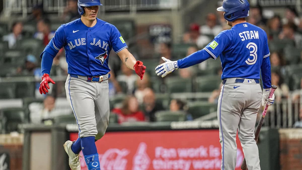 Toronto Blue Jays catcher Brandon Valenzuela (59) reacts with outfielder Myles Straw (3) after hitting a home run against the Atlanta Braves during the ninth inning at Truist Park.