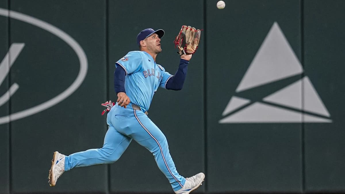 Toronto Blue Jays center fielder Daulton Varsho (5) makes a running catch on a ball hit by Atlanta Braves center fielder Michael Harris II (23) (not pictured) during the eighth inning at Truist Park.