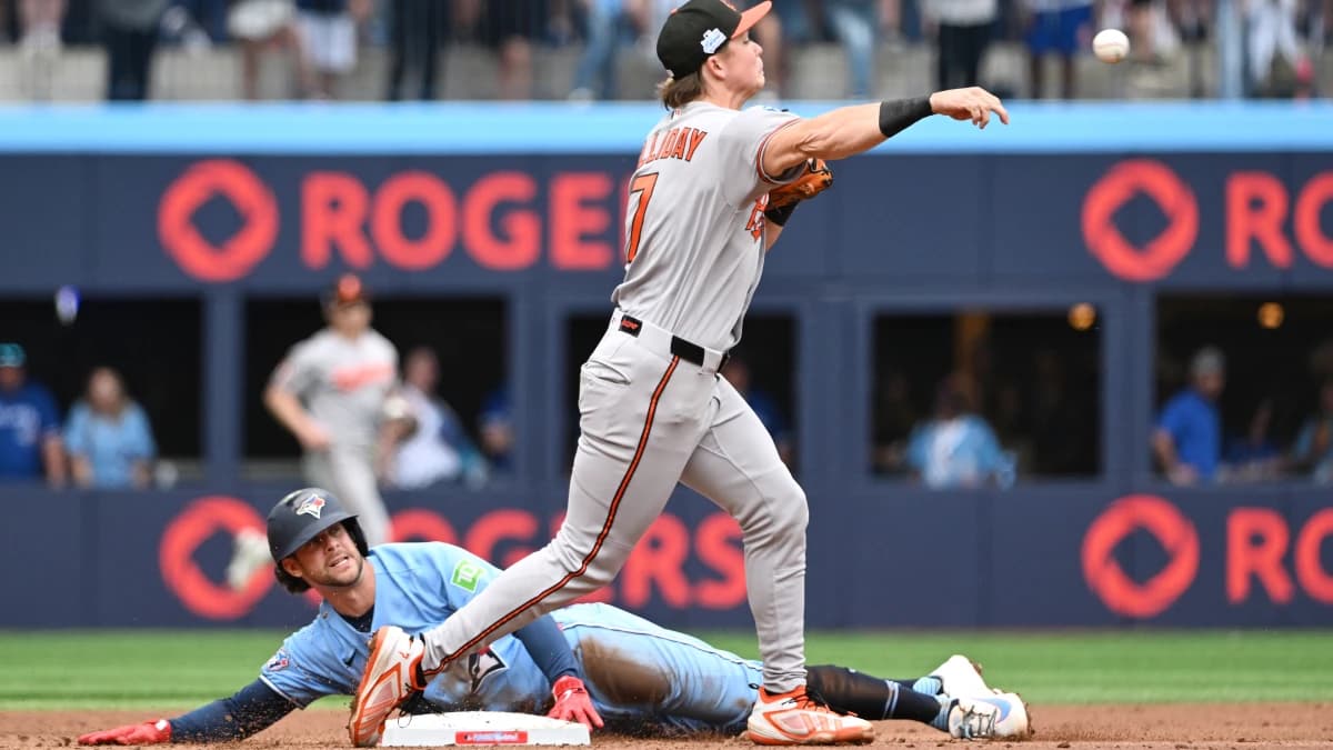 Baltimore Orioles second baseman Jackson Holliday (7) throws to first base but cannot turn a double play after forcing out Toronto Blue Jays second baseman Ernie Clement (22) in the second inning at Rogers Centre.
