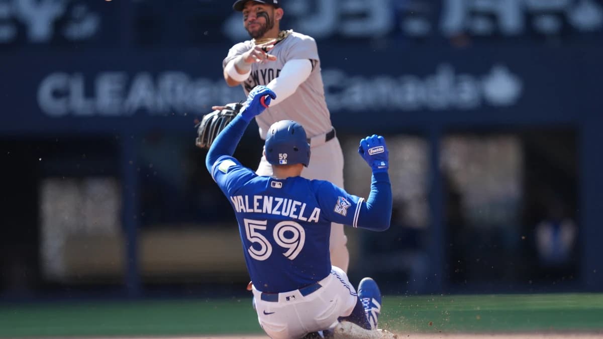 New York Yankees shortstop Jose Caballero (72) tags out Toronto Blue Jays catcher Brandon Valenzuela (59) at second base during the sixth inning at Rogers Centre.