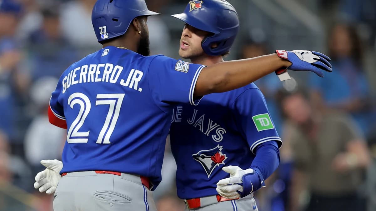 Toronto Blue Jays shortstop Ernie Clement (22) celebrates his three run home run against the New York Yankees with first baseman Vladimir Guerrero Jr. (27) during the fourth inning at Yankee Stadium.