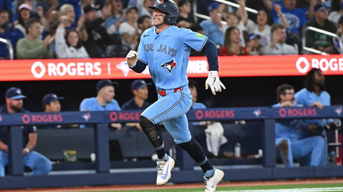 Toronto Blue Jays short stop Ernie Clement (22) scores in the fourth inning against the New York Yankees at Rogers Centre.