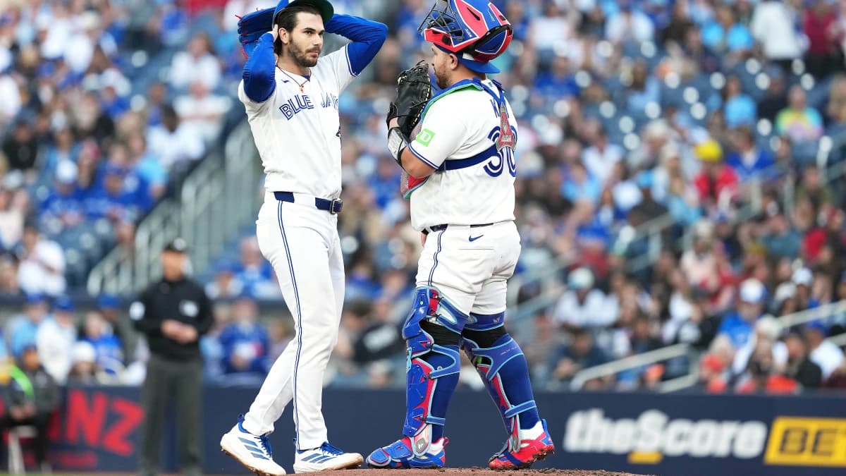 Toronto Blue Jays starting pitcher Dylan Cease (84) talks with catcher Alejandro Kirk (30) against the Houston Astros during the first inning at Rogers Centre.