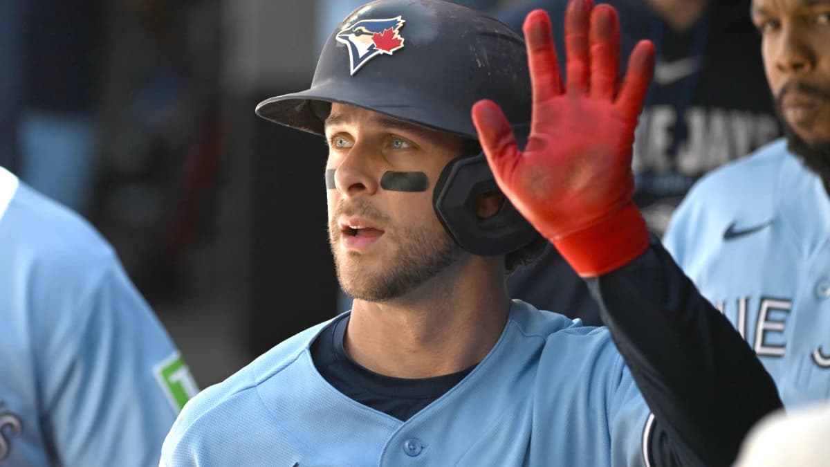 Toronto Blue Jays second baseman Ernie Clement (22) celebrates in the dugout with team mates after scoring a run against the Baltimore Orioles in the second inning at Rogers Centre.