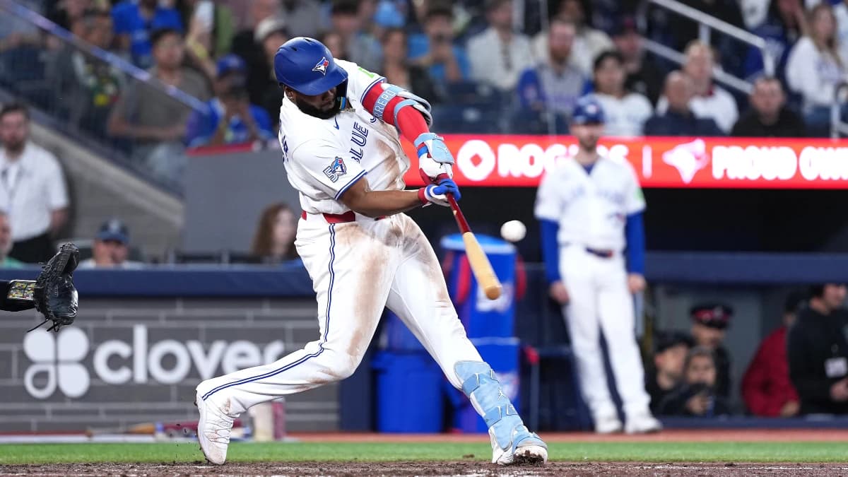 Toronto Blue Jays first baseman Vladimir Guerrero Jr. (27) hits a single against the Houston Astros during the eighth inning at Rogers Centre.