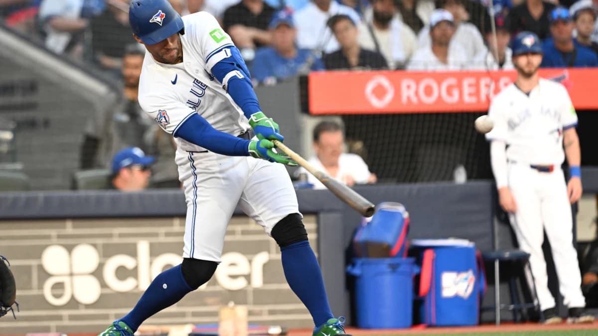 Toronto Blue Jays designated hitter George Springer (4) hits a triple that becomes an inside the park home run on an error against the New York Mets in the first inning at Rogers Centre.