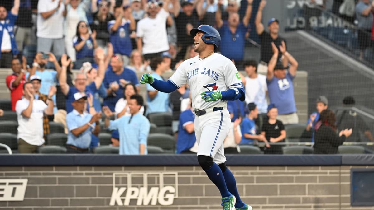 Toronto Blue Jays designated hitter George Springer (4) reacts after scoring a run on a triple and an error against the New York Mets in the first inning at Rogers Centre.