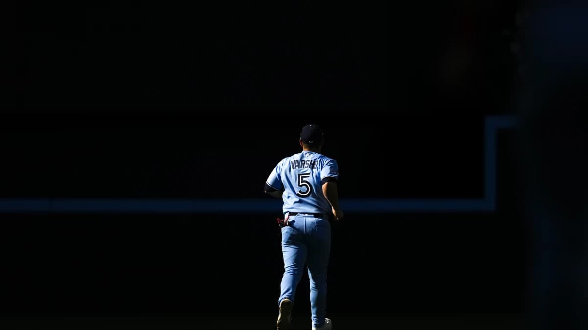 Toronto Blue Jays center fielder Daulton Varsho (5) returns to the outfield during the seventh inning against the Texas Rangers at Rogers Centre