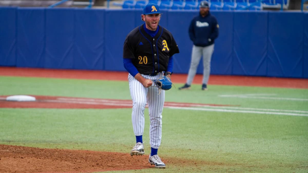Angelo State baseball's Dax Dathe (20) celebrates after a strikeout for the final out in the sixth inning against St. Edwards at 1st Community Credit Union Stadium in San Angelo on Saturday, April 5.