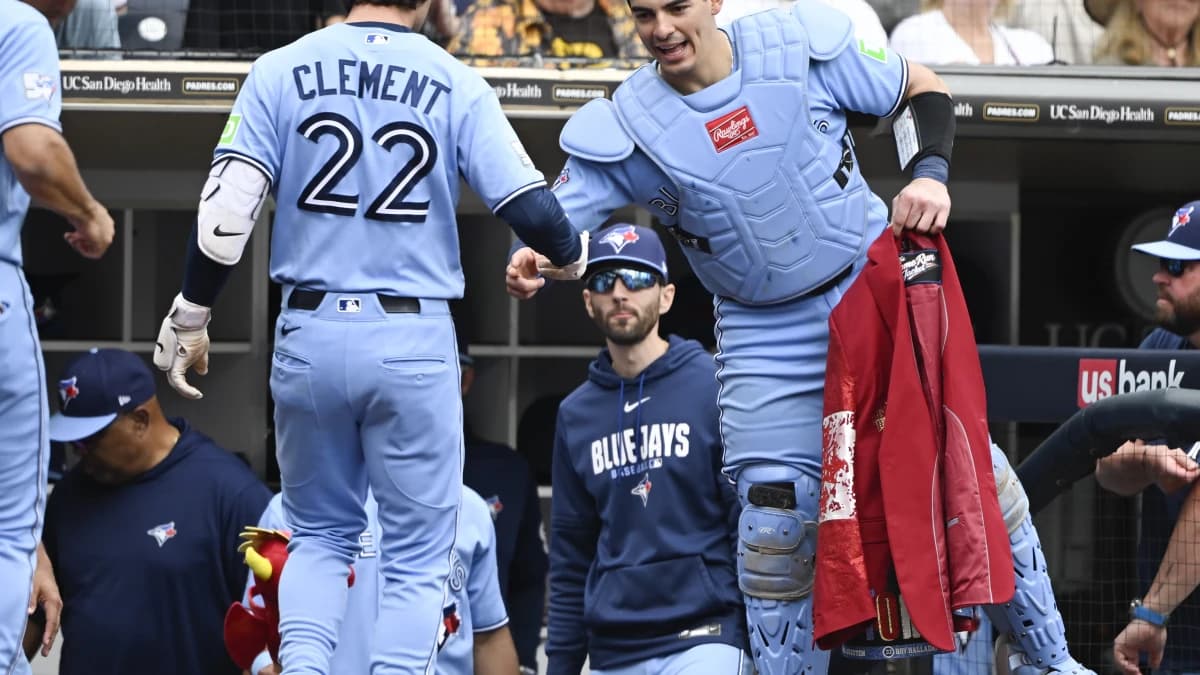 Toronto Blue Jays second baseman Ernie Clement (22) is congratulated by catcher Brandon Valenzuela (59) after hitting a two-run home run during the fourth inning against the San Diego Padres at Petco Park.