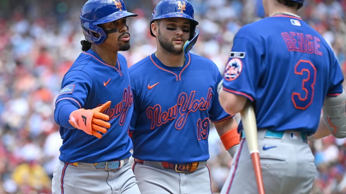 New York Mets shortstop Francisco Lindor (12) celebrates with shortstop Bo Bichette (19) and right fielder Carson Benge (3) after hitting a two-run home run during the first inning against the Philadelphia Phillies at Citizens Bank Park.