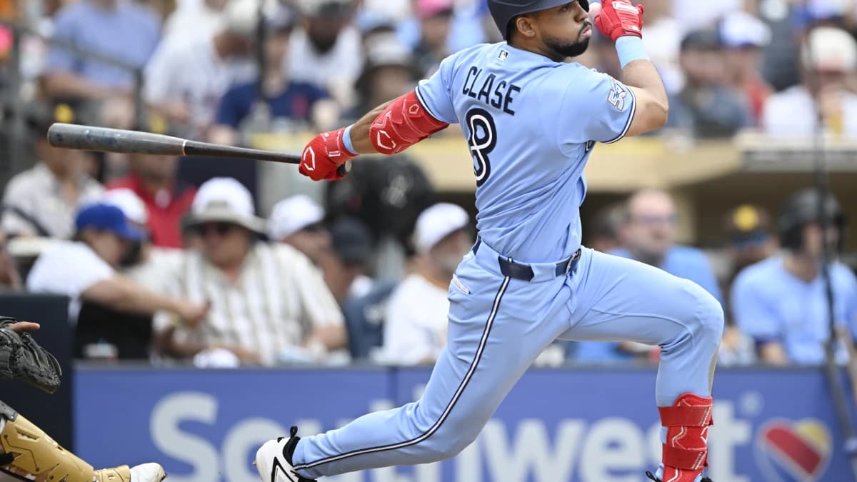 Toronto Blue Jays left fielder Jonatan Clase (8) hits an RBI single during the eighth inning against the San Diego Padres at Petco Park.