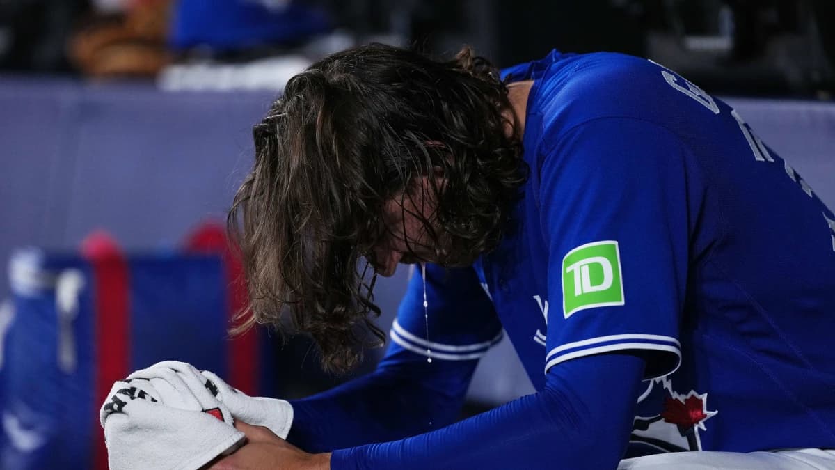 Toronto Blue Jays starting pitcher Kevin Gausman (34) sits in the dugout against the Tampa Bay Rays during the first inning at Rogers Centre.
