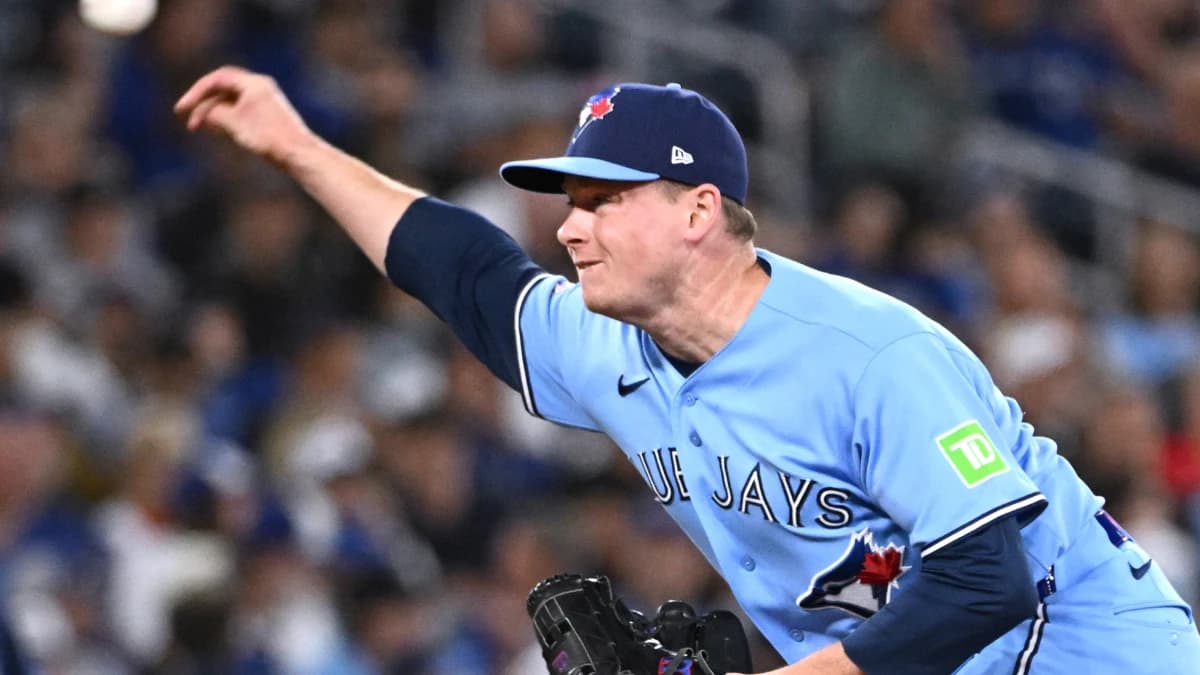 Toronto Blue Jays relief pitcher Louis Varland (77) delivers a pitch against the Tampa Bay Rays in the ninth inning at Rogers Centre.
