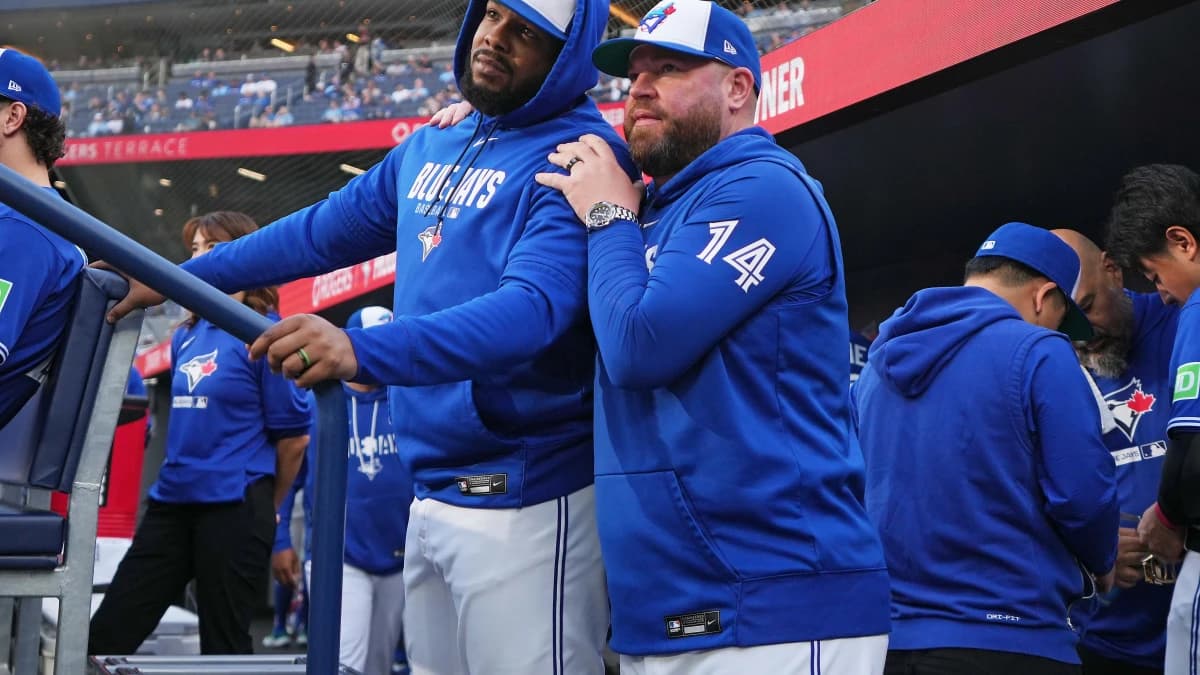 Toronto Blue Jays first baseman Vladimir Guerrero Jr. (27) talks with manager John Schneider (14) before the start of a game against the Miami Marlins at the Rogers Centre.