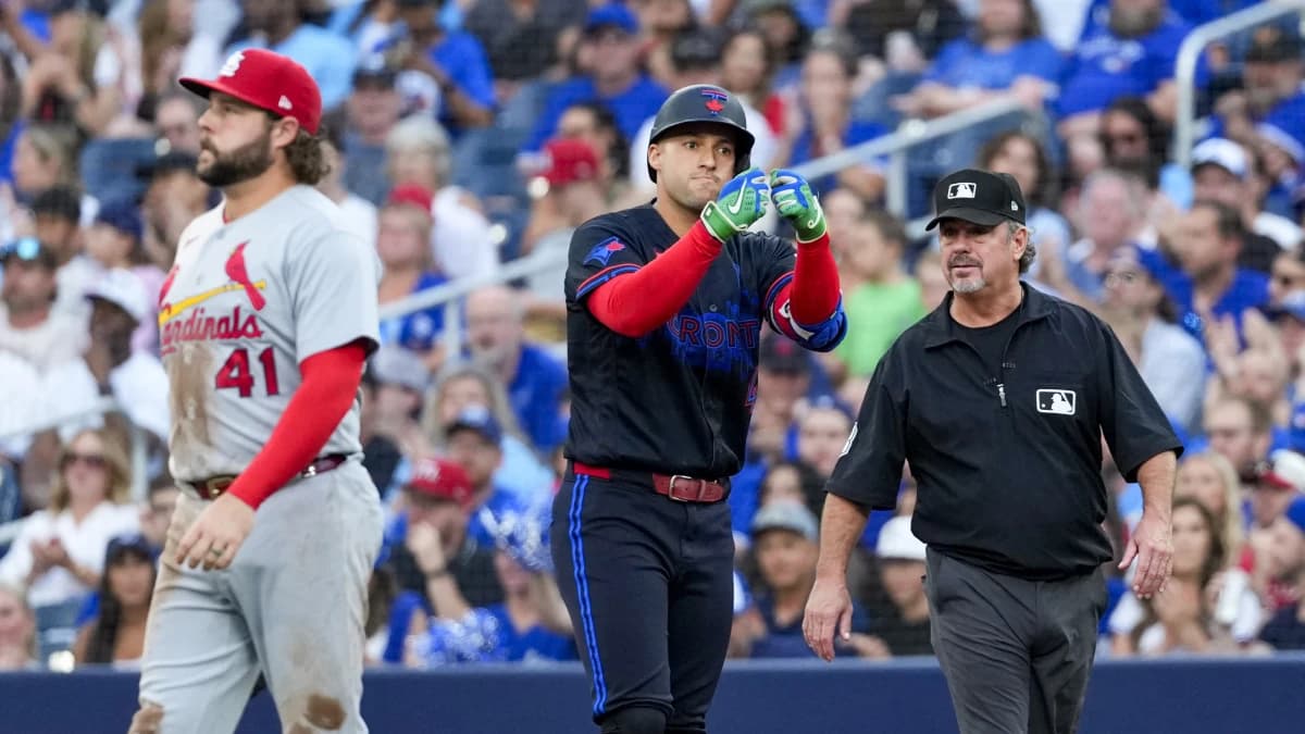 Toronto Blue Jays designated hitter George Springer (4) celebrates hitting a single against the St. Louis Cardinals during the second inning at Rogers Centre