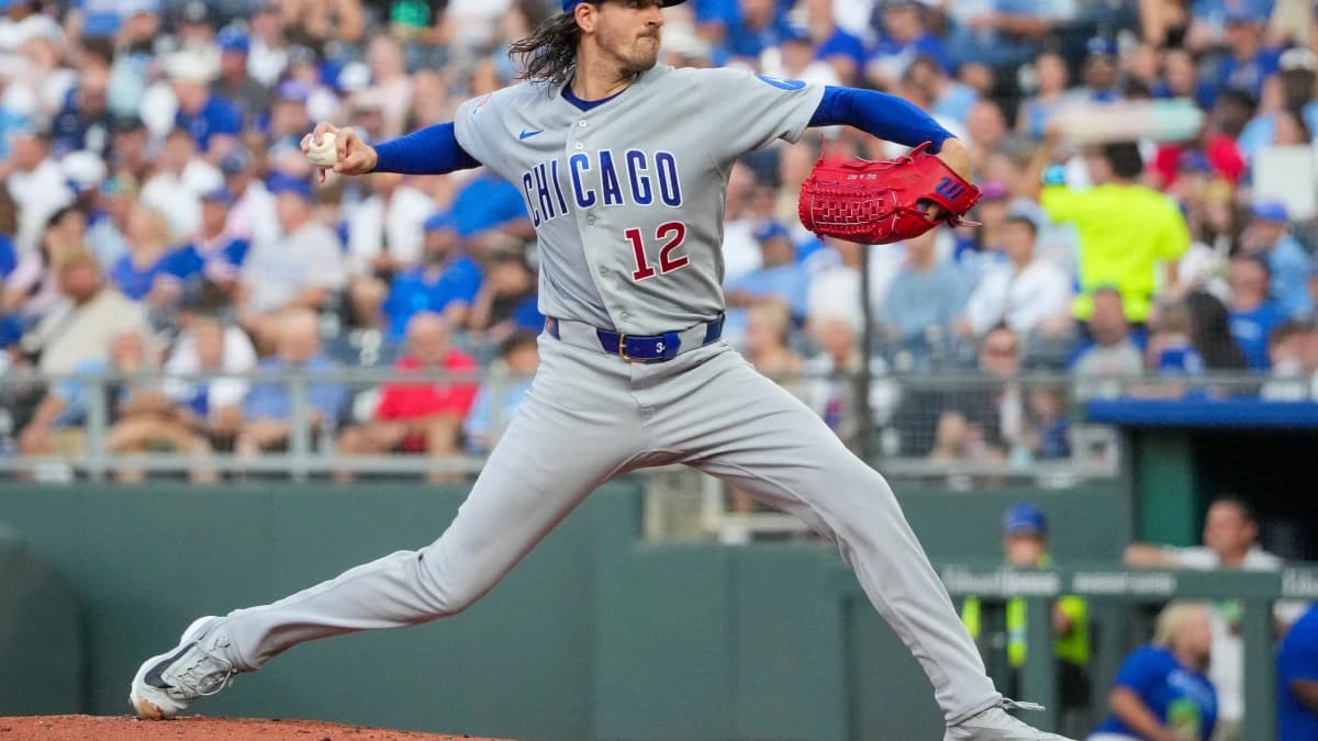Chicago Cubs starting pitcher Kevin Gausman (12) delivers a pitch against the Kansas City Royals during the first inning at Kauffman Stadium.