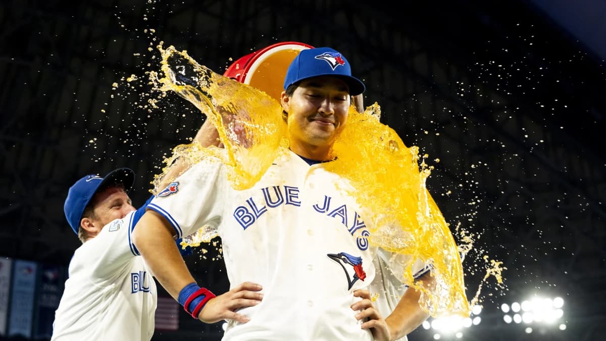 Toronto Blue Jays center fielder Brett Bateman (21) gets doused with a sports drink after defeating the Boston Red Sox at Rogers Centre.
