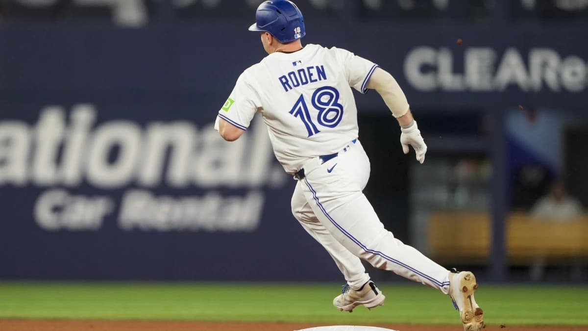 Toronto Blue Jays outfielder Alan Roden (18) rounds second base on his way to a triple against the Chicago White Sox during the seventh inning in their MLB game at Rogers Centre.