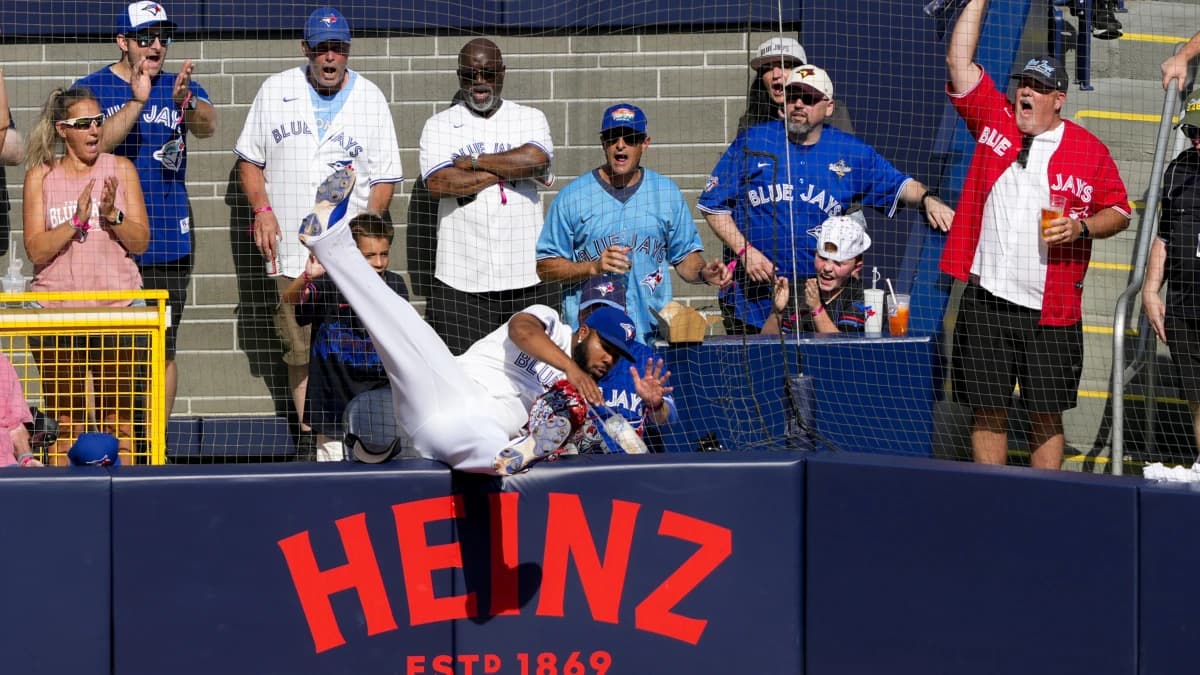 Toronto Blue Jays first baseman Vladimir Guerrero Jr. (27) crashes into the field netting during the sixth inning against the Boston Red Sox at Rogers Centre