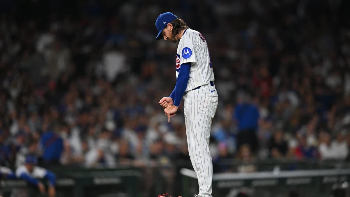 Chicago Cubs pitcher Kevin Gausman (12) reacts in an injury delay against the Chicago White Sox during the fourth inning at Wrigley Field.