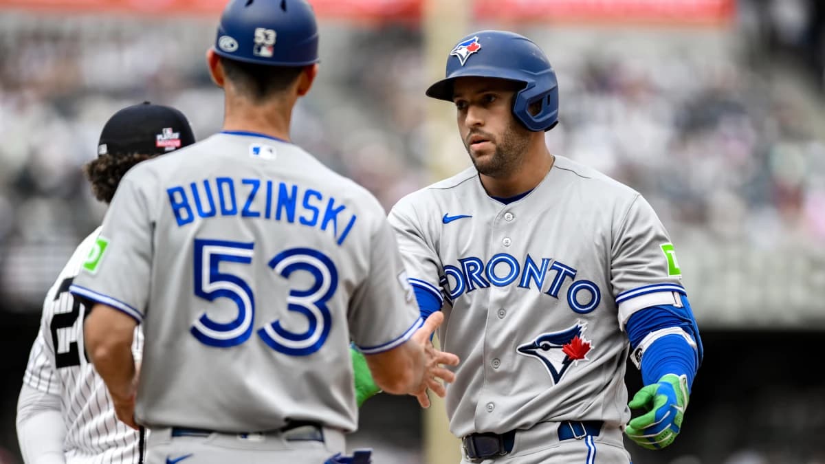 Toronto Blue Jays designated hitter George Springer (4) reacts after hitting a single against the New York Yankees during the fifth inning at Yankee Stadium.