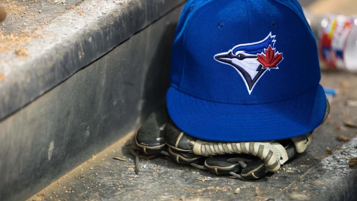 A view of a Toronto Blue Jays ball cap and logo during the game between the Texas Rangers and the Blue Jays at Globe Life Park in Arlington. The Blue Jays defeated the Texas Rangers 4-2.