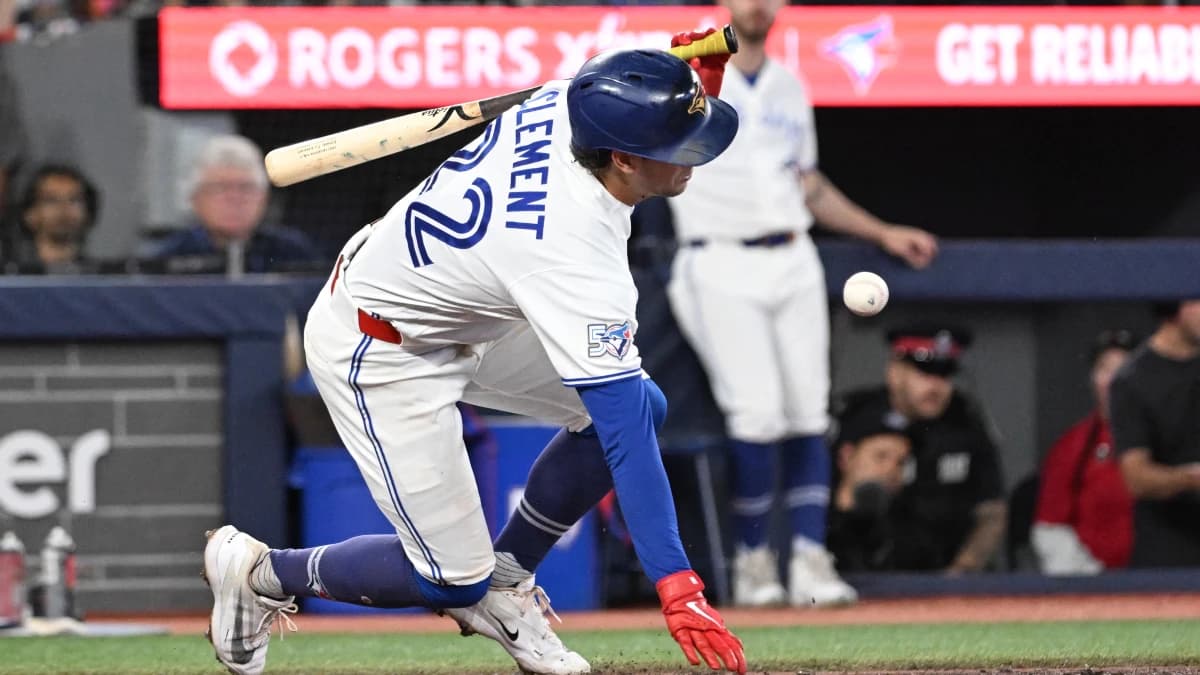 Toronto Blue Jays second baseman Ernie Clement (22) falls over after fouling a pitch off his knee against the Kansas City Royals in the eighth inning at Rogers Centre.