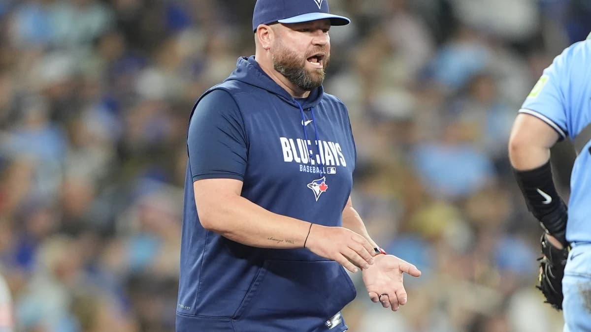 Toronto Blue Jays manager John Schneider visits the pitching mound during the eighth inning against the Kansas City Royals at Rogers Centre.
