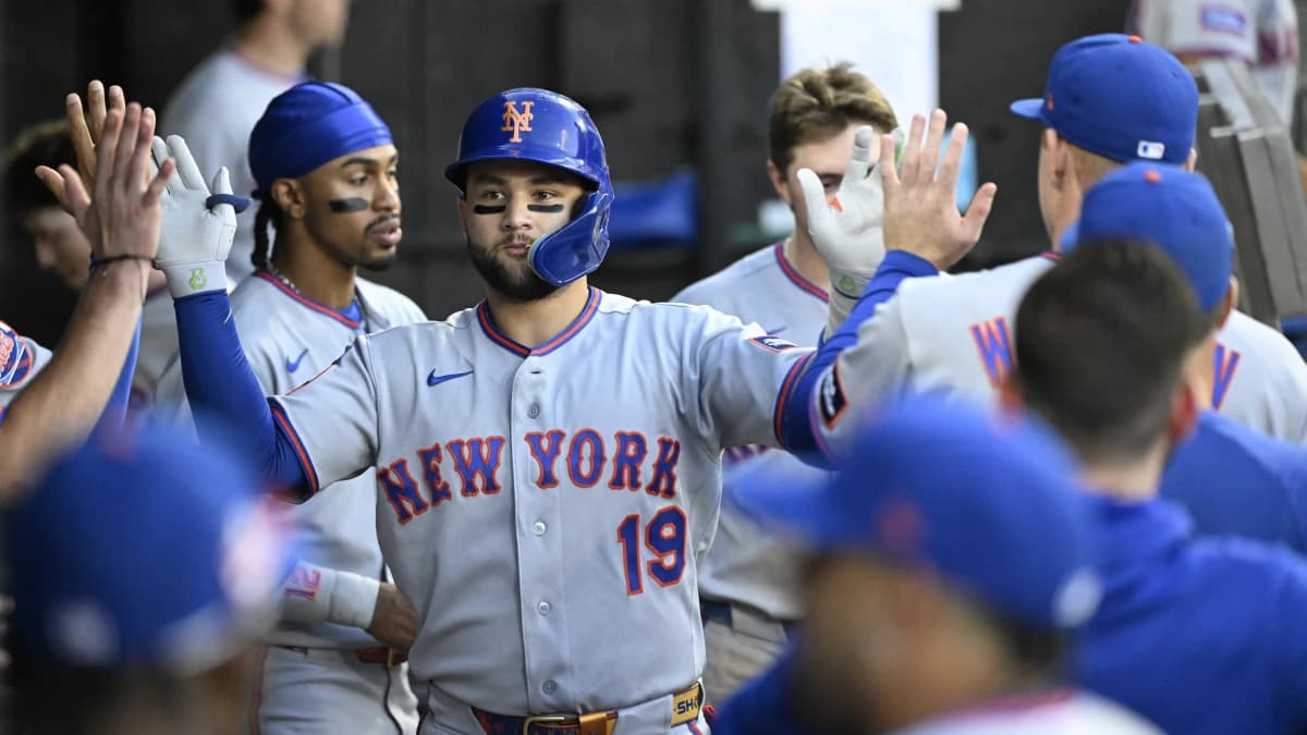 New York Mets third base Bo Bichette (19) celebrates with teammates in the dugout after hitting a home run during the third inning against the Chicago White Sox at Rate Field.