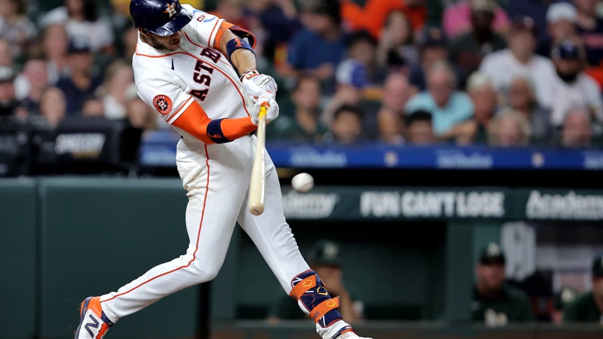 Houston Astros shortstop Jeremy Pena (3) hits an RBI single against the Athletics during the seventh inning at Daikin Park.
