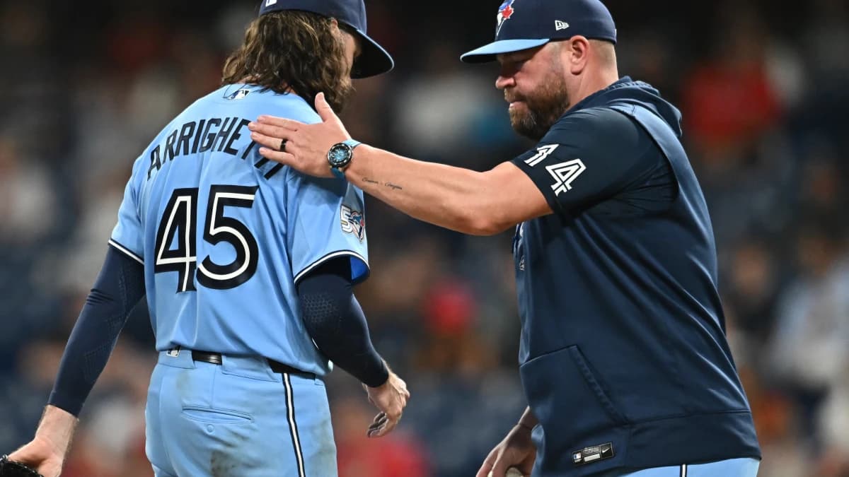 Toronto Blue Jays manager John Schneider (14) relives pitcher Spencer Arrighetti (45) during the sixth inning against the Cleveland Guardians at Progressive Field