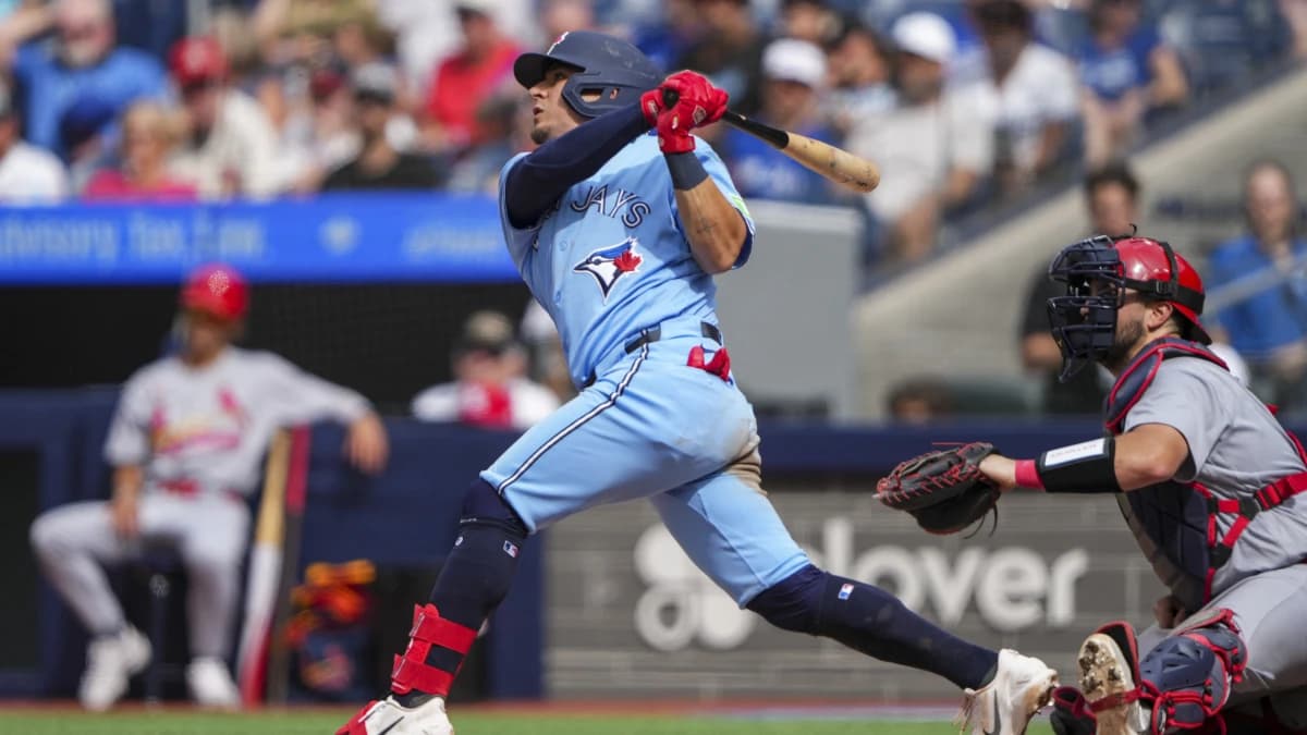 Toronto Blue Jays second baseman Luis Urías (48) hits a sacrifice fly during the fourth inning against the St. Louis Cardinals at Rogers Centre.