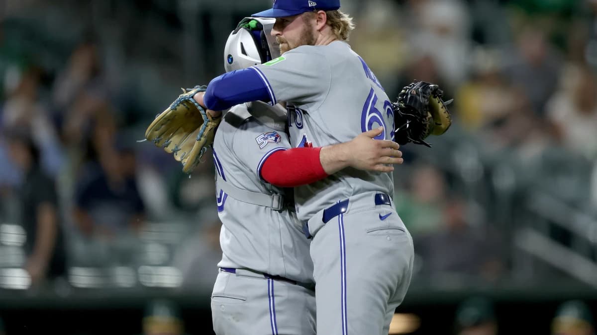 Toronto Blue Jays pitcher Spencer Miles (62) hugs catcher Alejandro Kirk (30) after their win against the Athletics at Sutter Health Park.
