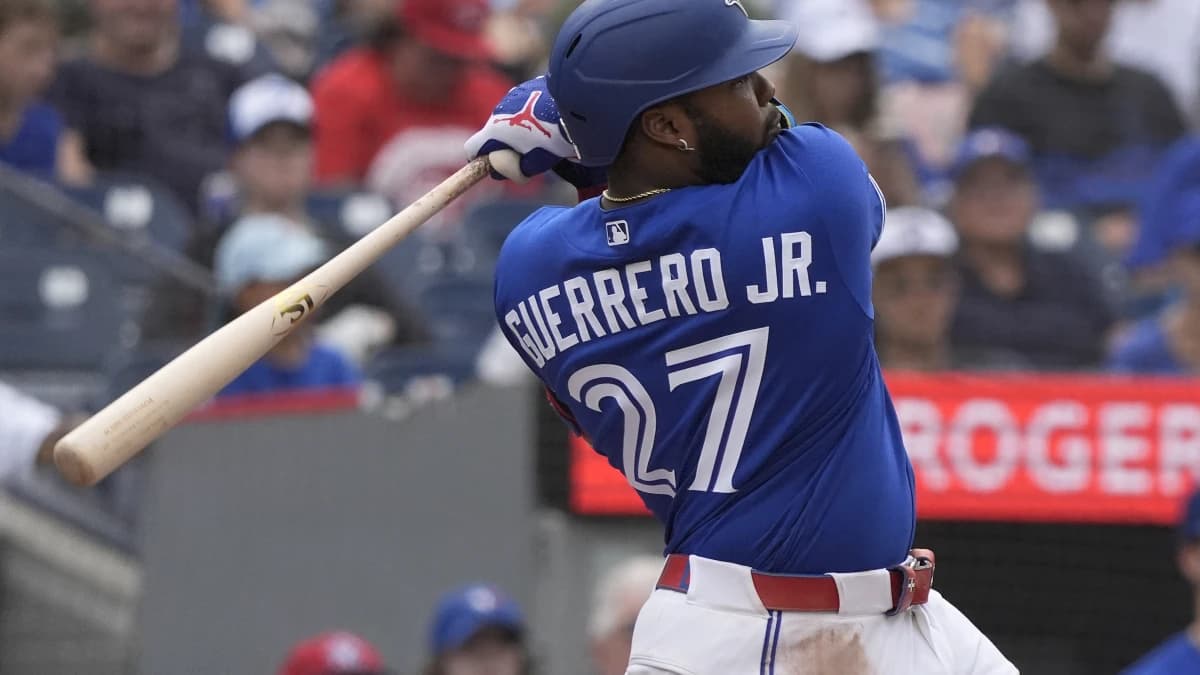 Toronto Blue Jays first baseman Vladimir Guerrero Jr. (27) hits a single against the Baltimore Orioles during the eighth inning at Rogers Centre.
