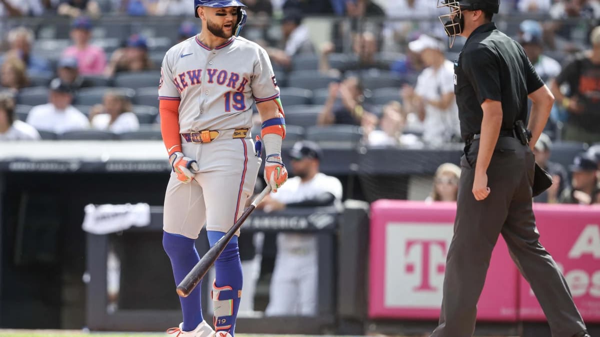 New York Mets third baseman Bo Bichette (19) argues with home plate umpire Willie Traynor (45) after being called out on strikes in the first inning against the New York Yankees at Yankee Stadium