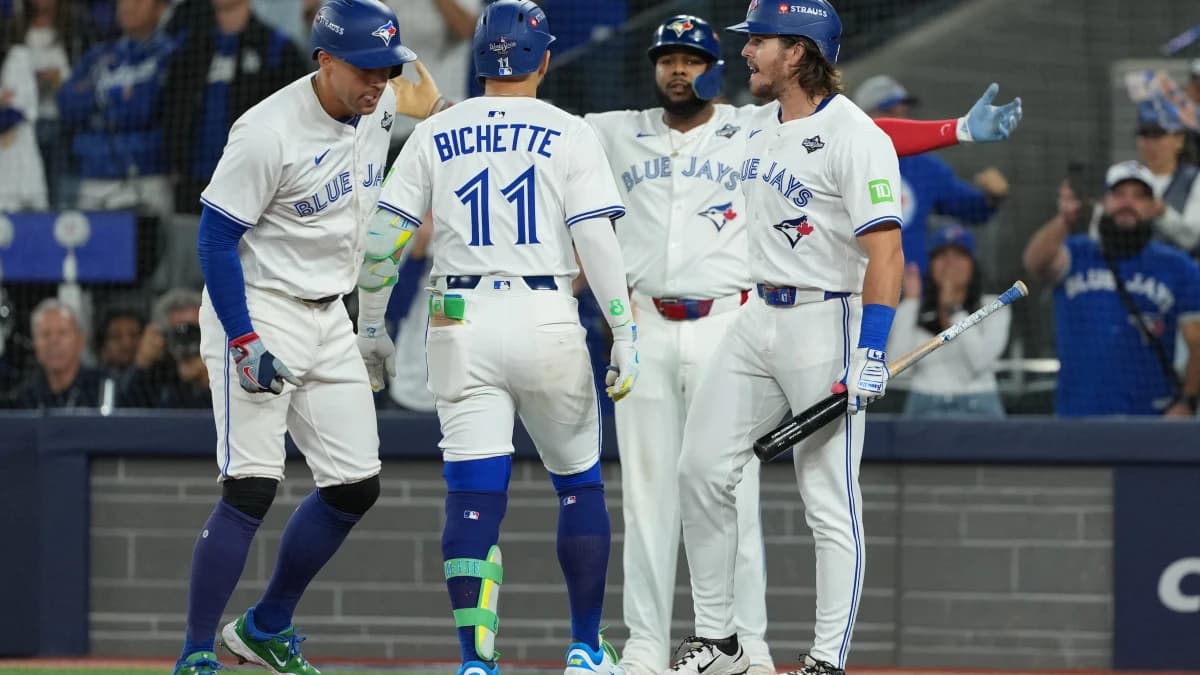 Toronto Blue Jays shortstop Bo Bichette (11) reacts after hitting a three run home run against the Los Angeles Dodgers in the third inning for game seven of the 2025 MLB World Series at Rogers Centre