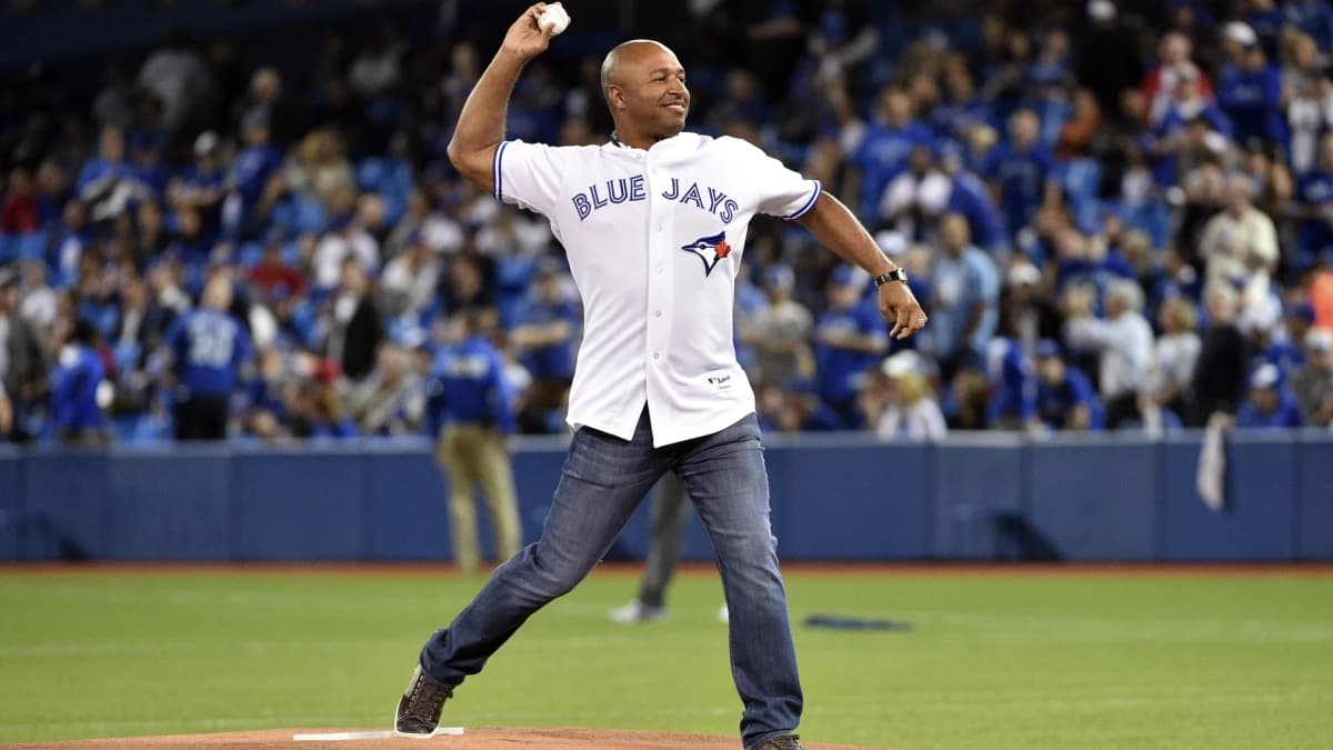 Toronto Blue Jays former player Vernon Wells throws out the ceremonial first pitch before the game against the Kansas City Royals in game five of the ALCS at Rogers Centre.