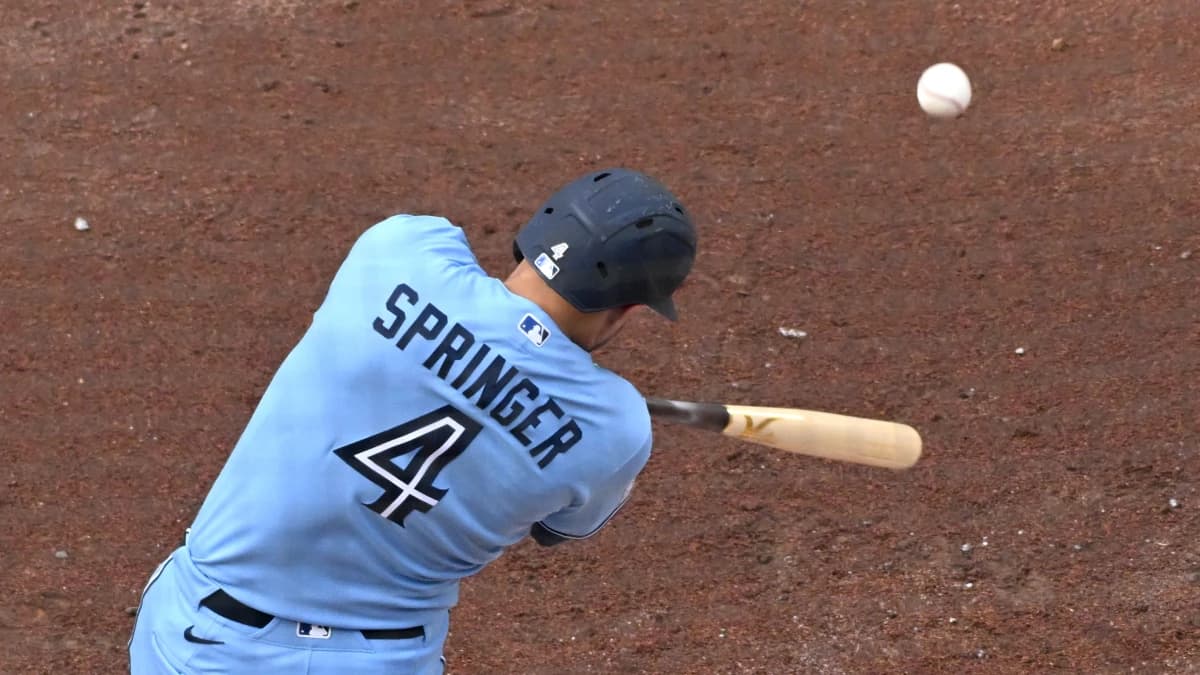 Toronto Blue Jays designated hitter George Springers (4) hits an RBI single against the Detroit Tigers in the fifth inning at Rogers Centre.