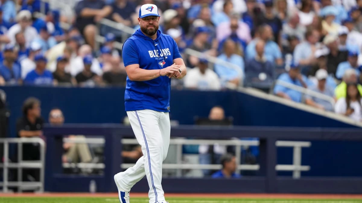 Toronto Blue Jays manager John Schneider (14) walks to the mound during the seventh inning against the Seattle Mariners at Rogers Centre.