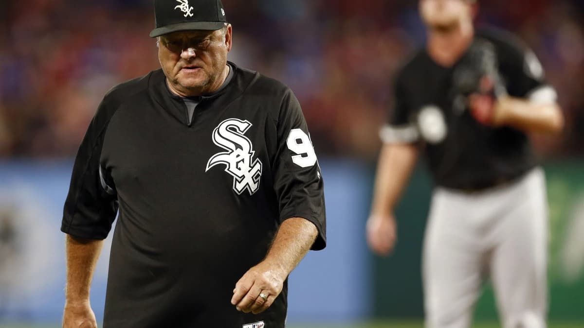Chicago White Sox pitching coach Don Cooper (99) walks back to the dugout after a conference with relief pitcher Dylan Covey during a baseball game against the Texas Rangers at Globe Life Park in Arlington.